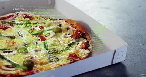 Displaying pizza in white box on grey tabletop with vegetable toppings and code Stock Photos