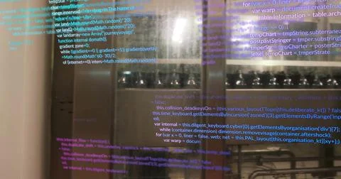 Displaying programming code on glass partition inside commercial kitchen, with 库存照片
