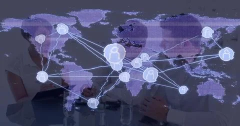 Displaying purple map overlay over glass table, showing user icons, clipboard, 库存照片