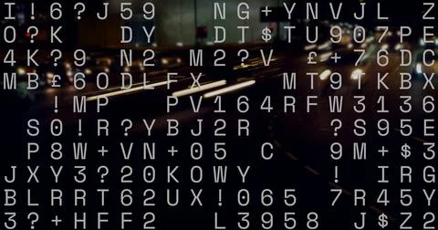 Displaying random white alphanumeric text overlaying night city highway, with Stockfoto's