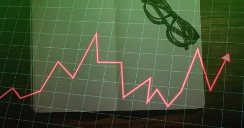 Displaying red line graph arrow rising over grid overlay on office desk, with Stock Photos