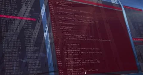 Displaying red-tinted code editor centered on screens at desk, showing REDACTED 스톡 사진