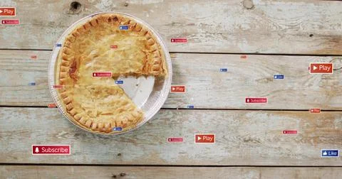 Displaying round pie with missing wedge in aluminum dish on rustic plank table, Stock Photos