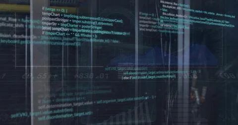 Displaying semi-transparent code and line graphs in dim control room with glass 스톡 사진