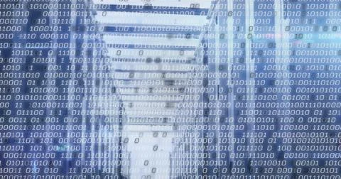 Displaying server racks streaming binary code overlay in data center corridor Stock Photos