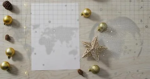 Displaying sheet showing dotted world map on light wood tabletop, with gold Stock Photos