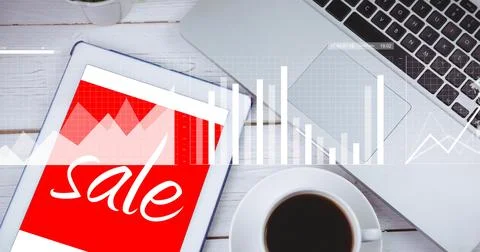 Displaying tablet-notebook showing red-sale graphic, white desk with laptop and Stock Photos