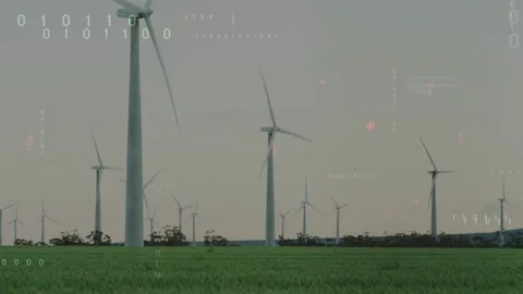 Displaying tall white wind turbines turning on rural plain, with binary streams Stock Footage 332505056