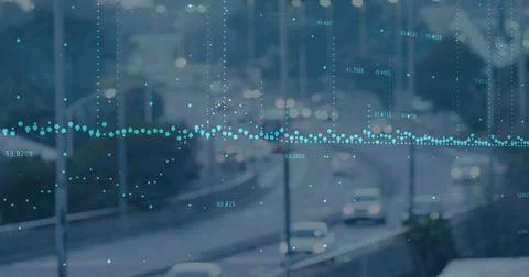 Displaying teal horizontal dotted waveform overlay across urban highway at dusk, Foto stock