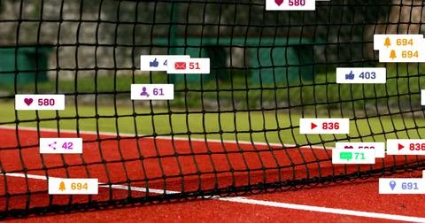 Displaying tennis net centered on red hard court with white line, showing social Stock Photos