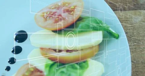 Displaying tomato mozzarella basil stack on plate at tabletop, with balsamic Stock Photos