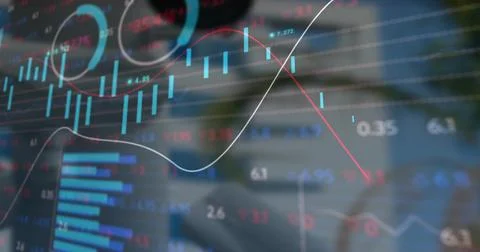 Displaying translucent candlestick and line graphs over wooden desk, with 스톡 사진
