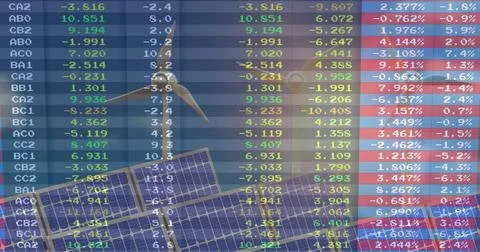 Displaying translucent data grid overlaying solar panels wind turbine in art, Foto stock