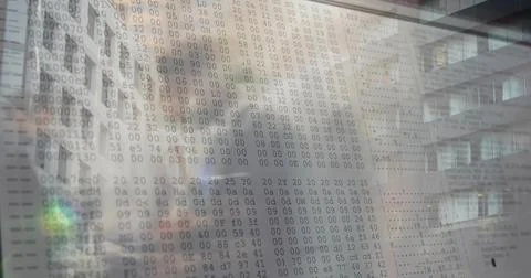 Displaying translucent display showing hexadecimal dump in office atrium with Foto stock