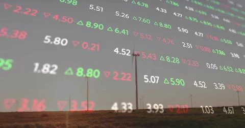 Displaying translucent market-data overlay covering wind farm at dusk, showing Stock Photos