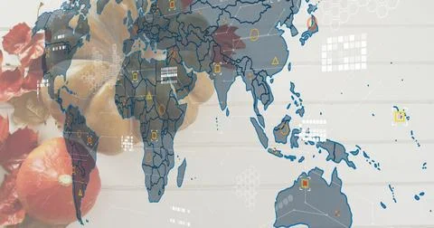 Displaying translucent world map with data markers over fruits and leaves on Stock Photos