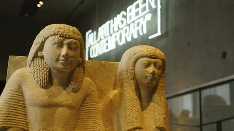 Displaying two limestone statues from ancient egypt, likely representing ph.. Stock Photos
