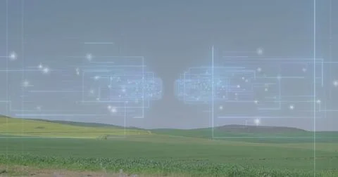 Displaying two semi-transparent network overlays hovering above farmland, with Foto stock