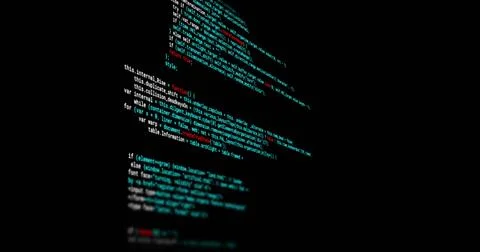 Displaying vertical code pane tilting on dark screen, showing cyan red white Stock Photos