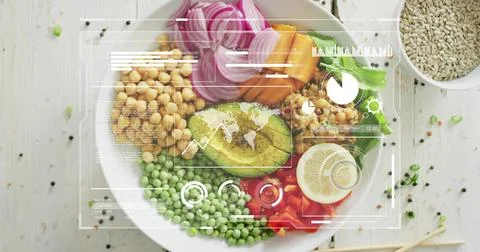 Displaying white ceramic bowl featuring halved avocado and chickpeas on pale Stock Photos