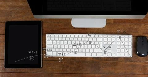 Displaying white computer keyboard centered on wood desk with monitor, tablet, Stock Photos