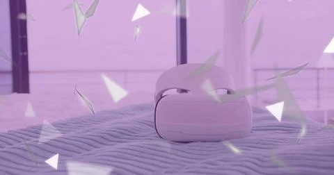 Displaying white virtual reality headset sitting on ribbed blanket by window, Stock Photos