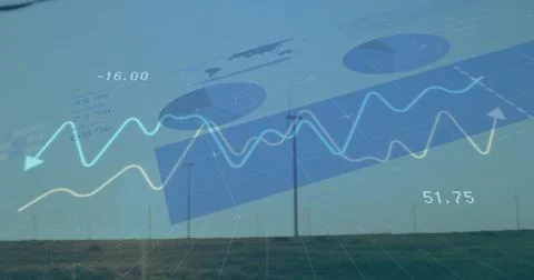Displaying wind turbines showcasing renewable energy metrics on grassy plain, Foto stock