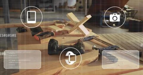 Displaying workbench in workshop featuring drills, C-clamp, jig, wood shaving Stock Photos