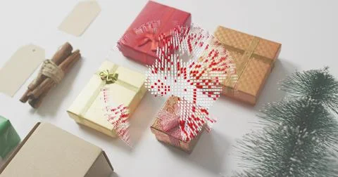 Displaying wrapped boxes forming holiday scene on white table, with bows, tags, Stock Photos