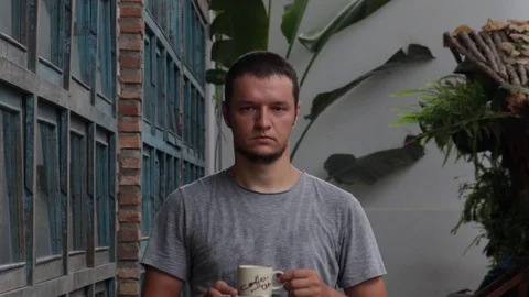 Displeased man is drinking coffee. Stock Footage 119539148