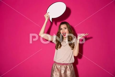 Displeased young woman holding speech bubble over head. Stock Photos