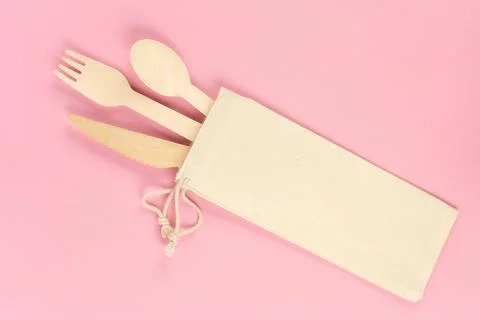 Disposable bamboo tableware, spoon, knife, fork eco-friendly in a natural bag Stock Photos