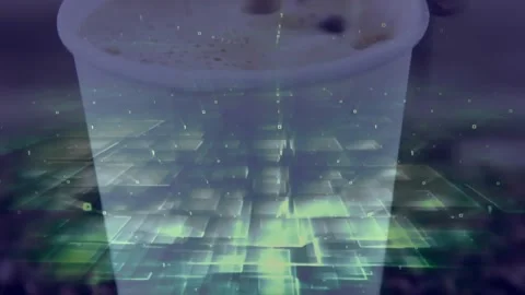 Disposable coffee cup floating over green digital grid merging binary digits in Stock Footage 329167299