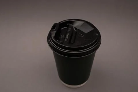 Disposable coffee cup with plastic lid Stock Photos