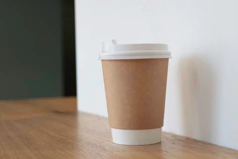 Disposable cup. Mock up with a cup of coffee. Stock Photos