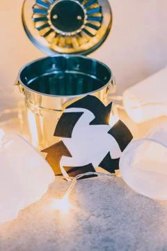 Disposable cups and garbage bin with recycle symbol, concept of reducing sing Stock Photos