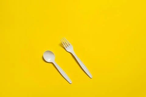 Disposable eco-friendly fork and spoon made of corn starch Stock Photos