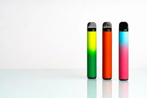 Disposable electronic cigarettes on white background Stock Photos