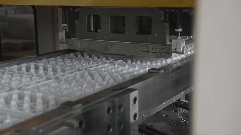Disposable food package ware manufacturing plant, eggs container production line Stock Footage 100119417