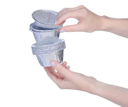 Disposable forms for cupcakes in hand Stock Photos