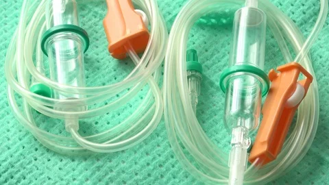 Disposable infusion set on green background Stock Footage 85948035