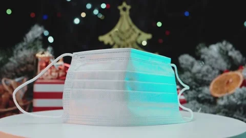 Disposable mask on the background of the Christmas tree. Stock Footage 145613130