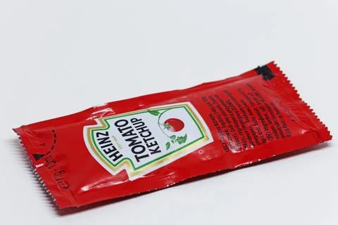 A disposable package of tomato ketchup Stock Photos