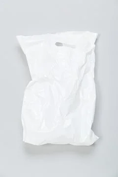 Disposable plastic bag on grey background. Space for your text Stock Photos