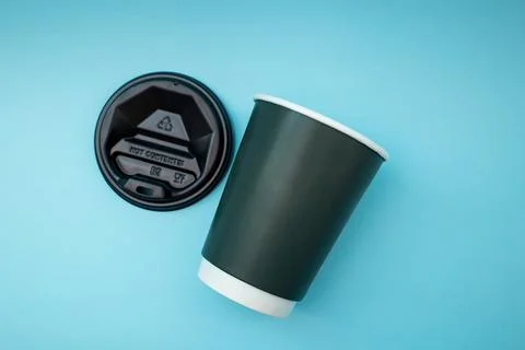 Disposable plastic cup on background, social problem, environmental disaster Stock Photos