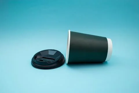 Disposable plastic cup on background, social problem, environmental disaster Stock Photos
