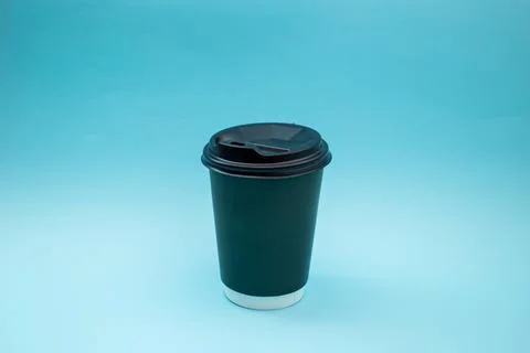 Disposable plastic cup on background, social problem, environmental disaster Stock Photos