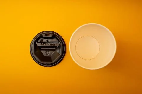 Disposable plastic cup on background, social problem, environmental disaster Stock Photos