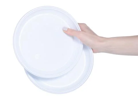 Disposable plastic dishes in hand Stock Photos