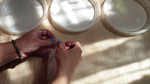 Disposable plastic tableware. Plastic dishes on the table. Stock Footage 113060183